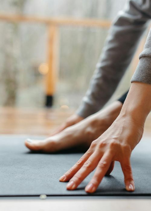 Close-up shot of feet on a training mat, emphasizing stability.