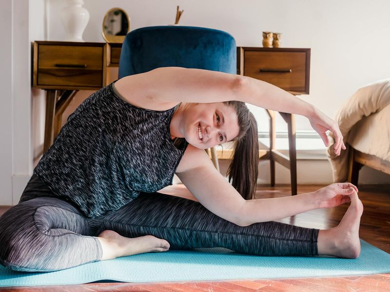 Spacious minimalist room with a yoga mat, ideal for home workouts.
